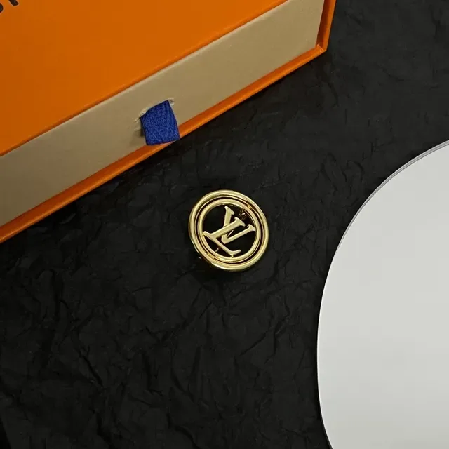Louis Vuitton Monogrammed Gold-Tone Circular Brooch 5