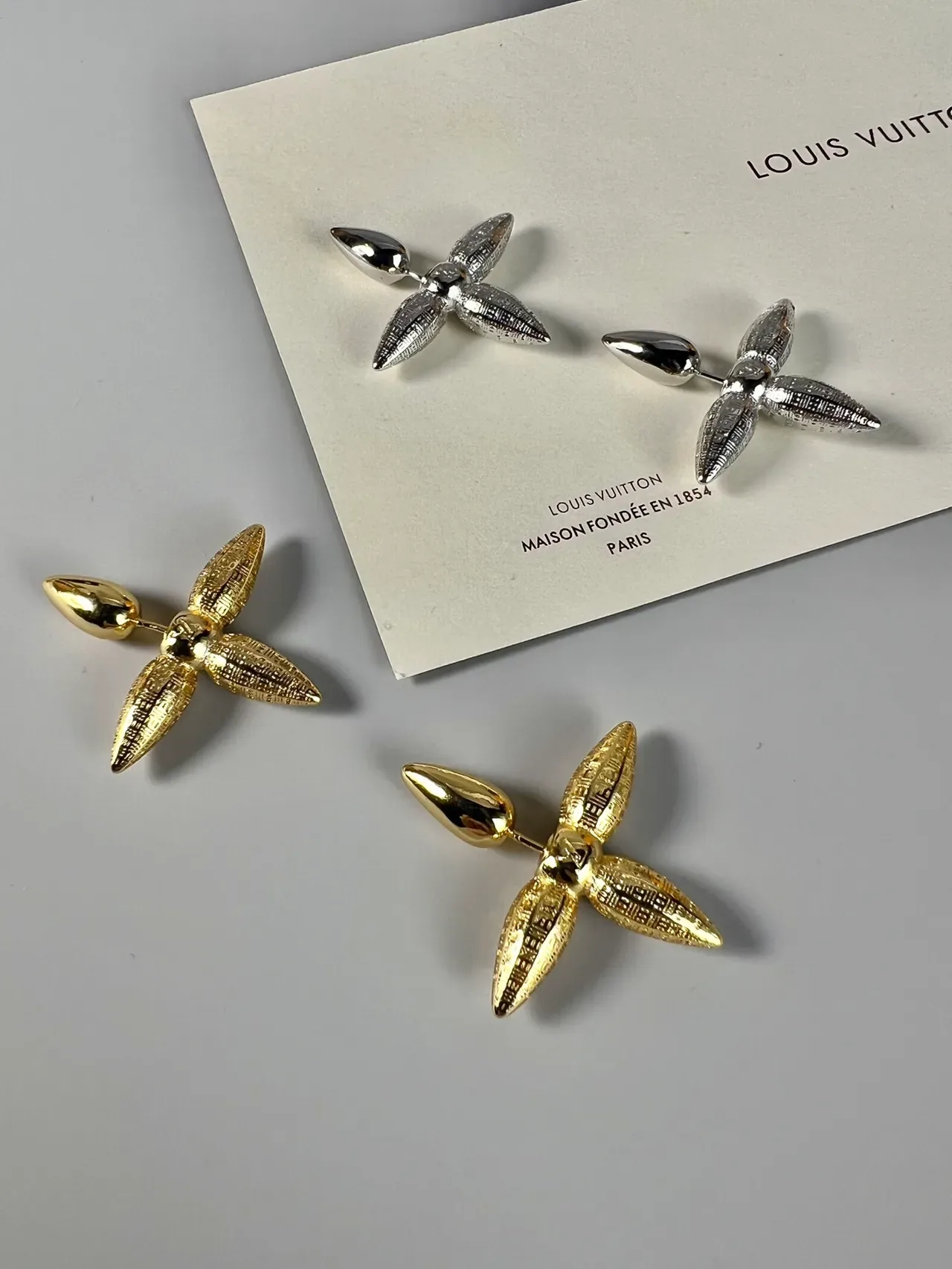 Louis Vuitton Silver Spiked Four-Pointed Earrings 9
