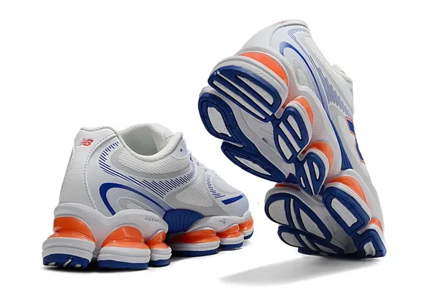 New Balance 9060 Blanc Bleu Segmented Orange Mediasole Pods Maille et Recouvrement Synthétique Supérieur Sneakers Chunky 3