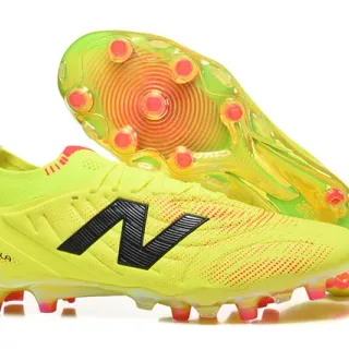 New Balance Tekela أصفر برتقالي منخفض القطعة طوق محبوك رباطات غير متماثلة أحذية كرة القدم للأرض الصلبة