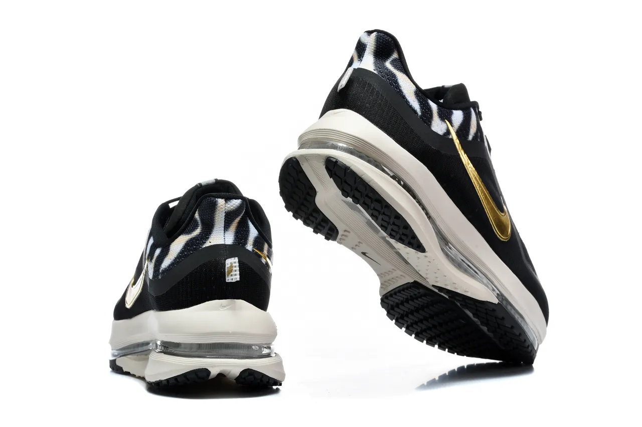 Chaussures de course Nike noir et or imprimé zébré en textile supérieur Swoosh métallique 8
