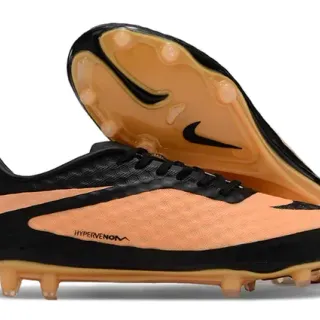 Nike أحذية كرة القدم أسود برتقالي منخفض القطعة علوية صناعية نسيج خلايا النحل أمامية أرضية صلبة