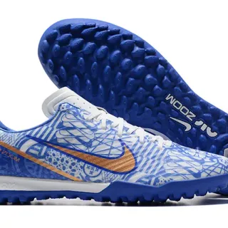 Nike Zapatos de fútbol turf azul naranja de bajo corte con patrón gráfico en la parte superior