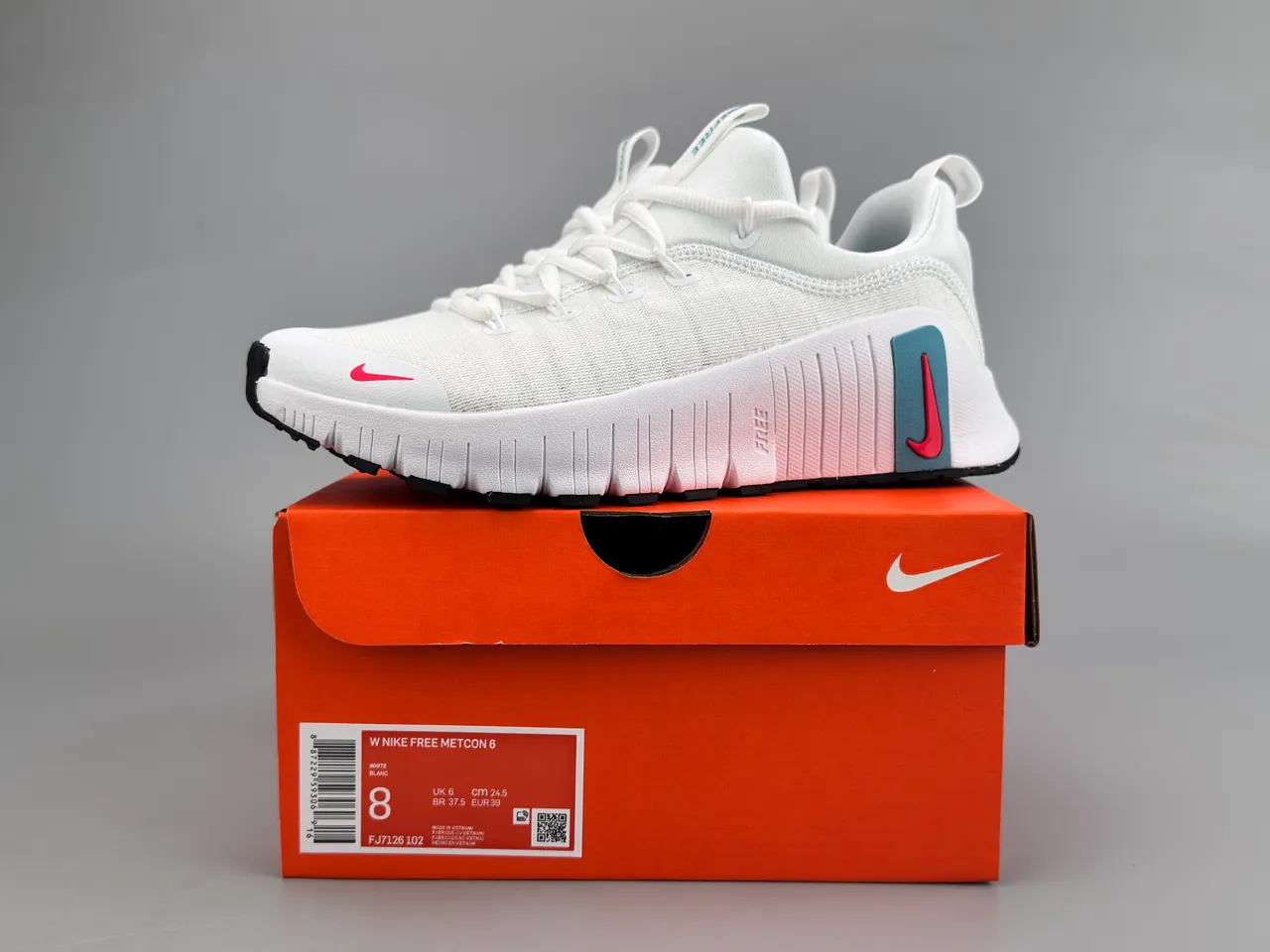 Nike Free RN chaussures de course avec upper en knit blanc et rouge, semelle segmented flex groove 2