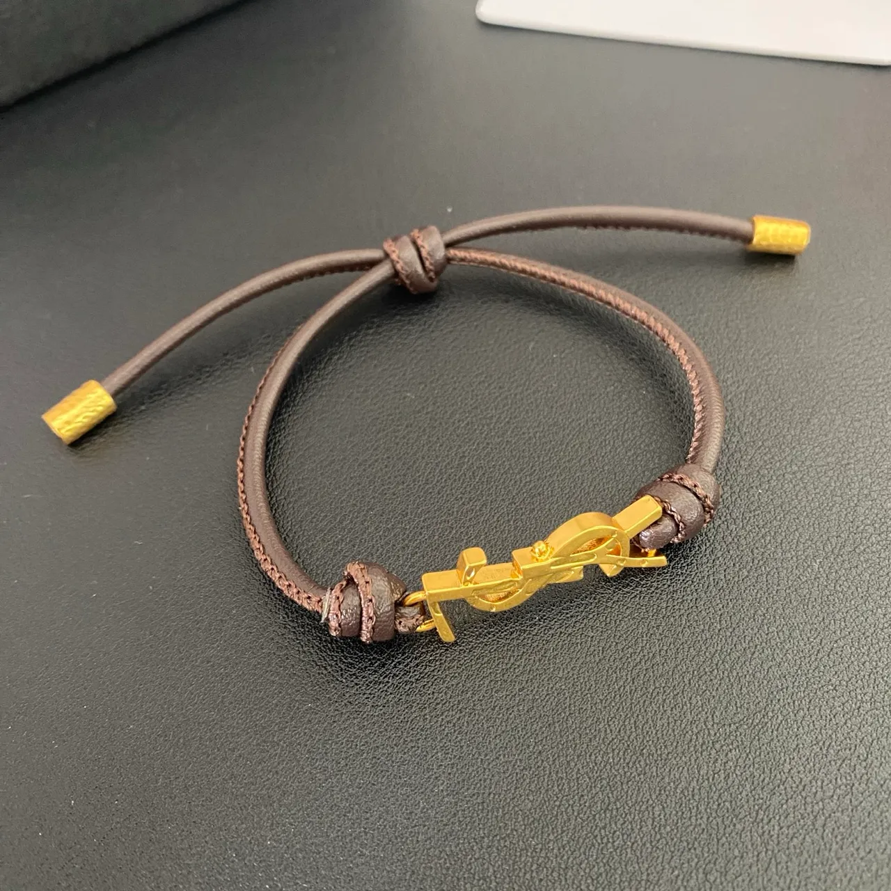 Saint Laurent YSL Monogram Preto Marrom interligado encanto cordão ajustável construção pulseira 5