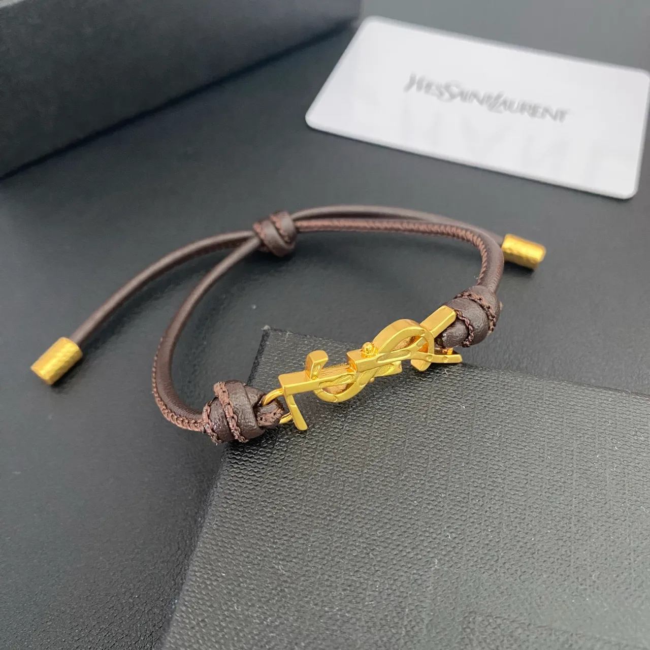 Saint Laurent YSL Monogram Preto Marrom interligado encanto cordão ajustável construção pulseira 7