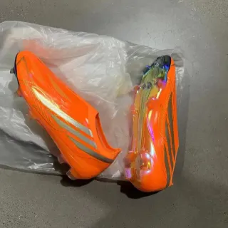 Adidas X Speedflow কমলা ইরিডেসেন্ট Firm-Ground ফুটবল জুতো