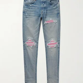 Amiri Distressed Patchwork Light-Wash Blue Jeans