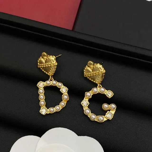 Boucles d'oreilles Dolce & Gabbana or et argent en forme de cœur avec chaîne supérieure 2