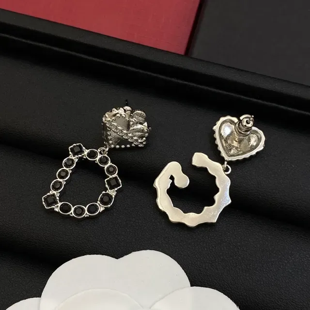 Boucles d'oreilles Dolce & Gabbana or et argent en forme de cœur avec chaîne supérieure 4
