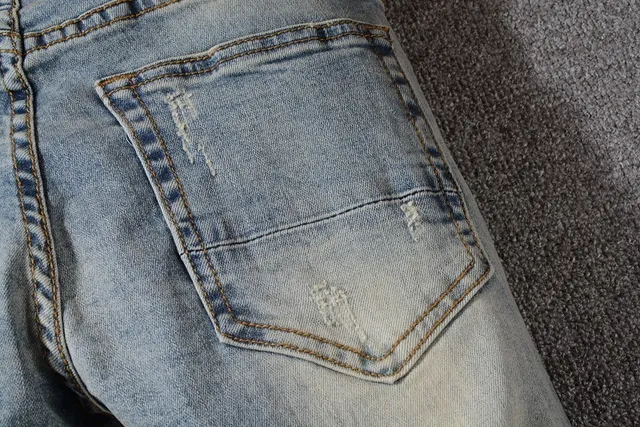 Distressed Light-Wash Blue Raw Hem Jeans 12