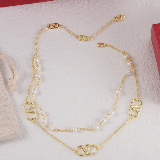 Dual-Layer Pearl and V-Charmed Chain Necklaces 6