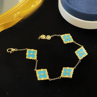 Pulsera de cadena dorada azul esmalte turquesa motivos de cuatréfol