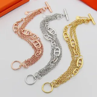 Pulsera de Oro y Plata con Cadena Múltiple y Broche de Palanca