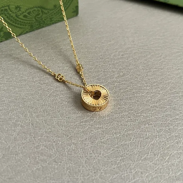Gold-Tone Sunburst Pendant Necklace 2