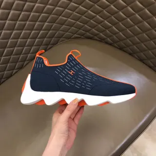 Sapatilhas lifestyle Navy Orange com upper de malha de meias, superior esculpida, media sola ondulada