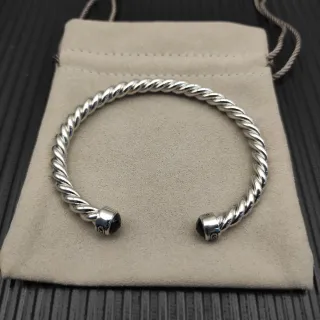 Pulsera de cable trenzado negro plateado metal pulido