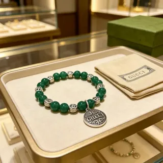 Gucci Beaded Green Stone and Silver-Tone Pendant Bracelet