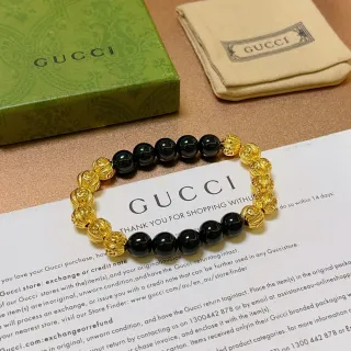 Gucci Pulsera Negra y Dorada de Cuentas Alternante