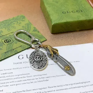 Gucci Feather Silver Gold Metal Keychain Ornate Circular Medallion Bracelet