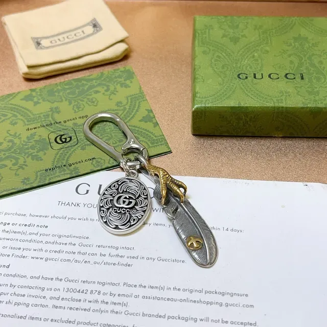 Gucci Feather Silver Gold Metal Keychain Ornate Circular Medallion Bracelet 2