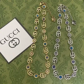 قلادة Gucci Ophidia ذهبية فضية مع روابط GG متشابكة ونقوش زهور أقحوان