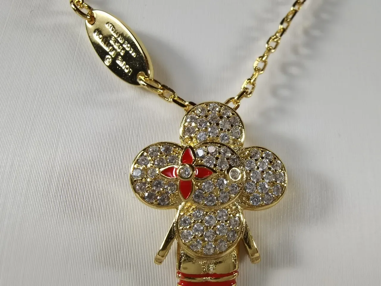 Louis Vuitton Gold-Tone Crystal Flower Pendant Necklace 7
