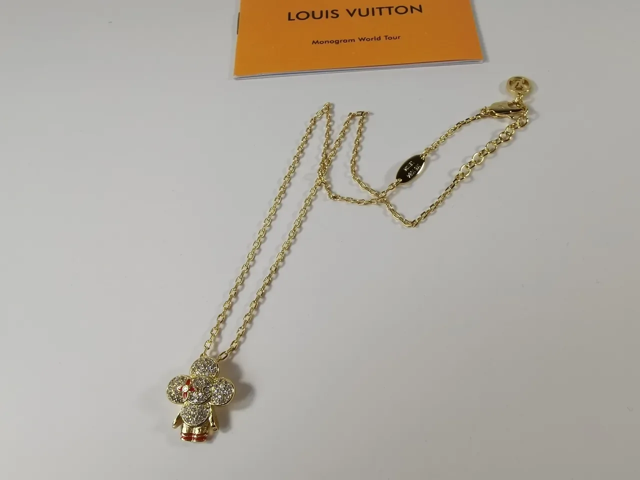 Louis Vuitton Gold-Tone Crystal Flower Pendant Necklace 9