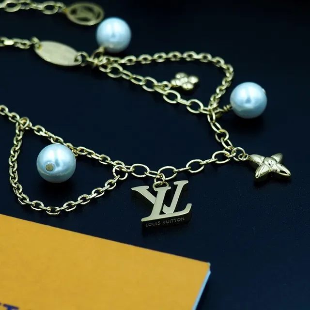Louis Vuitton Gold-Tone Pearl and Charms Chain Bracelet 4