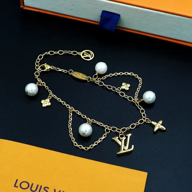 Louis Vuitton Gold-Tone Pearl and Charms Chain Bracelet 10