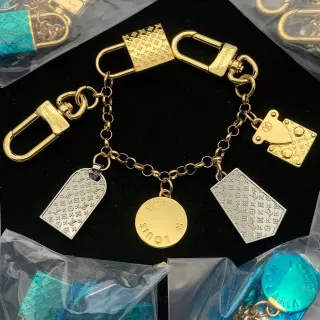 سوار Louis Vuitton Monogram تعويذة ذهبي فضي منحوت