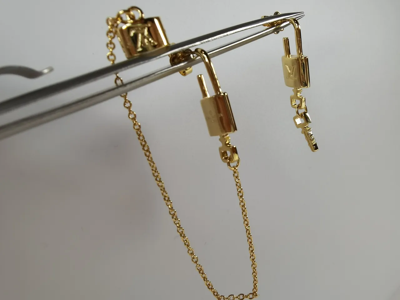 Louis Vuitton Monogram World Tour Lock-and-Key Gold-Tone Earrings 7