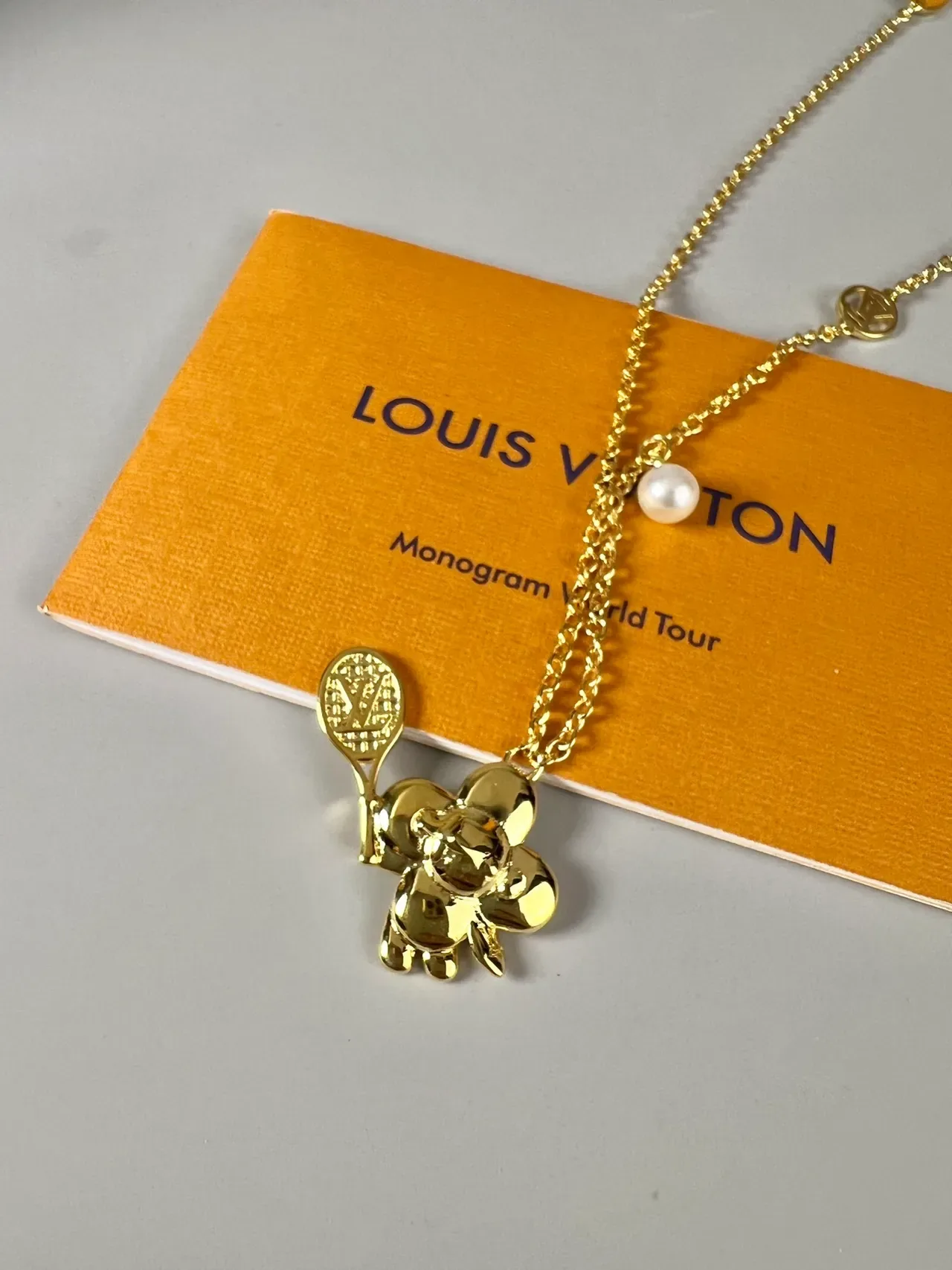 Louis Vuitton Multi-Charm Gold-Tone Pearl Necklace 9
