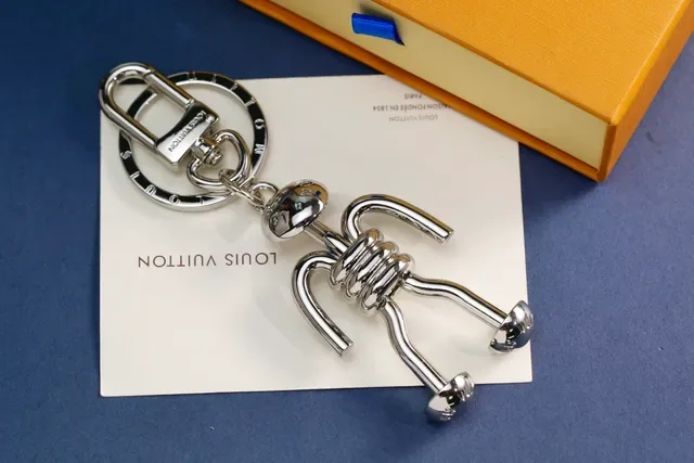 Louis Vuitton Silver Gold Articulated Stick-Figure Silhouette Coiled Torso Detail Crossbody Bag 5