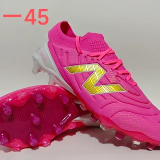 New Balance Tekela Chaussures de football semelles fermes rose or col de chaussette tricoté lacets asymétriques