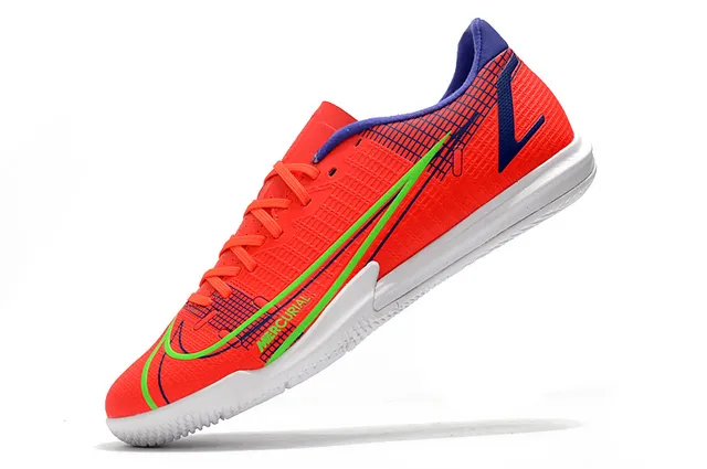 Nike Tênis de futebol indoor de corte baixo upper sintético overlay texturizado em grade color azul laranja 16