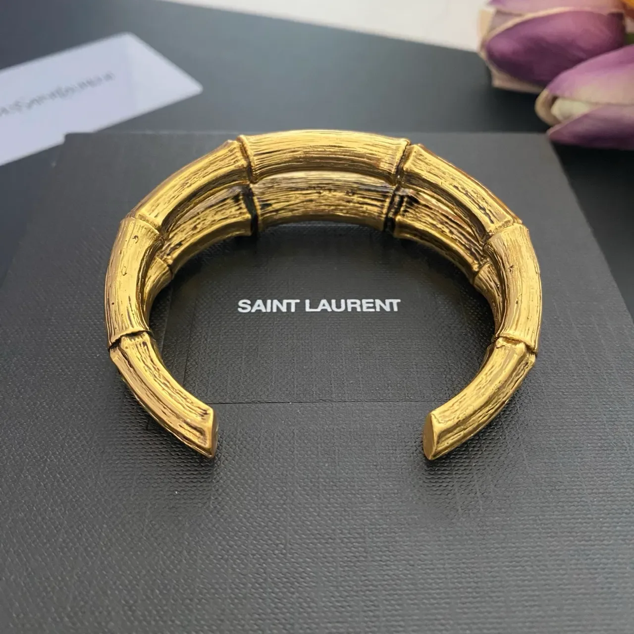 Saint Laurent سوار مفتوح ذهبي من البامبو 9