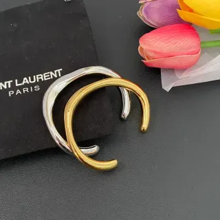 Saint Laurent أساور ذهبية وفضية مصقولة بشكل C مفتوحة