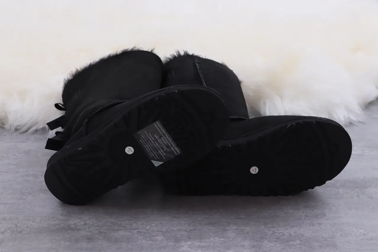 UGG Classic Tall Botas de rodilla negras con lazo 6