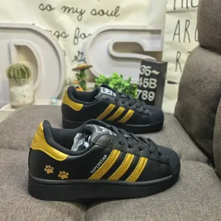 Adidas Superstar Black and Gold Paw Print Lifestyle Sneakers
