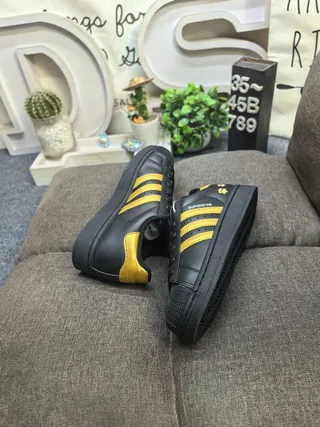 Adidas Superstar Black and Gold Paw Print Lifestyle Sneakers 6