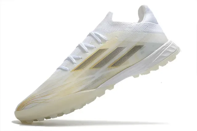 Adidas Chaussures de football turf blanches et dorées à profil bas en matériau synthétique avec rayures métalliques 3