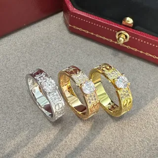 Cartier Love Ring Silver and Gold Pavé Diamond Central Stone Rings