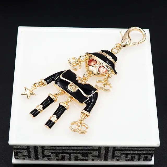 Chanel Black Gold Enamel Figurine Hardware Brooch 5