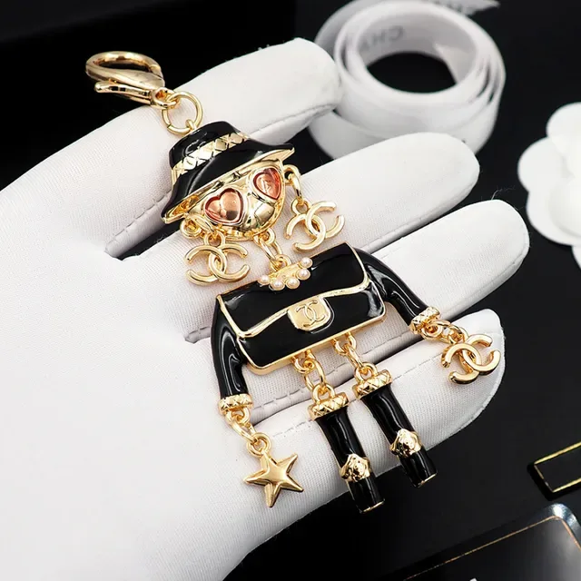 Chanel Black Gold Enamel Figurine Hardware Brooch 6