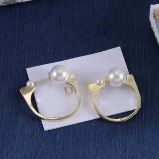 Dior Boucles d'oreilles dorées double perle asymétriques en C