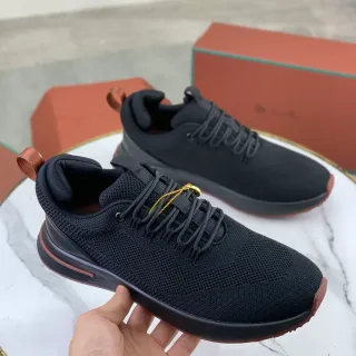 Zapatillas negras y marrones de upper de punto con acento en suela terracota