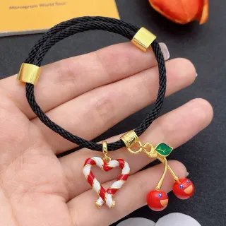 Pulsera de cordón trenzado negro y oro con herrajes