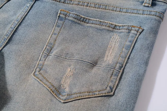Distressed Paint-Splattered Ripped Cuffed Light Blue Jeans 3