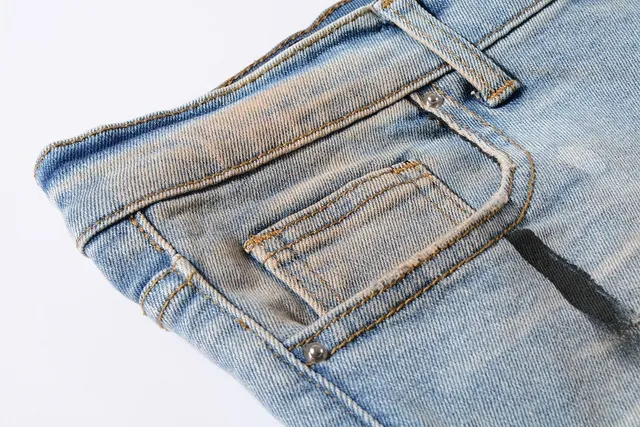 Distressed Paint-Splattered Ripped Cuffed Light Blue Jeans 11